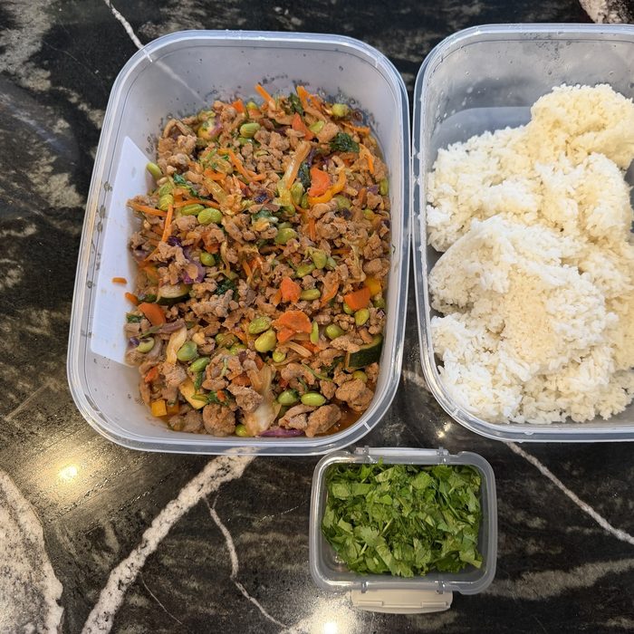 Asian chicken stir-fry with vegetables, rice and cilantro